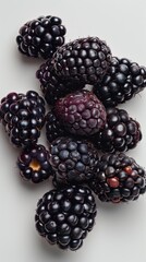 Wall Mural - A Bunch of Blackberries on a White Surface