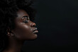 © MagnusCort - A close up of a black woman's face with her eyes closed looking to a side