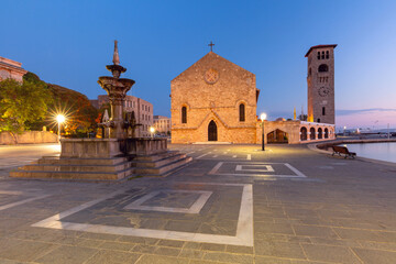 Wall Mural - Evangelismos Church and historic fountain in Rhodes, Greece, illuminated at twilight