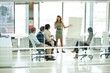 © peopleimages.com - Woman, presentation and colleagues in boardroom or meeting, business planning and white board demonstration. Presenter, company and goals with strategy, collaboration and professional project