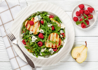 Wall Mural - grilled pear salad with cheese, arugula, berries