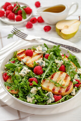 Wall Mural - grilled pear salad with cheese, arugula, berries