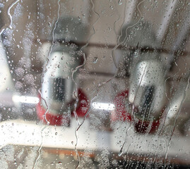 Wall Mural - Car glass at a car wash In drops of water. Background