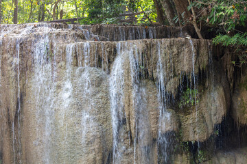 Wall Mural - Waterfall along a tropical river in Thailand