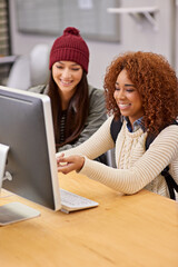 Wall Mural - Students, girls and teamwork with computer in library for assignment, academic research and education. Campus, college or university for knowledge, learning and friends with essay assessment by pc