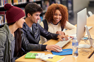 Wall Mural - Scholarship, knowledge and students research for computer, test or assignment in library on campus. University, education and friends learning in college project class with technology and information