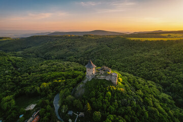 Ruins of a medieval castle Somoska or Somoskoi var. on borders of southern Slovakia and Hungary at sunrise time.