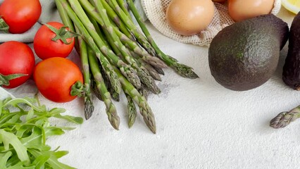 Wall Mural - Fresh Vegetables and Eggs Arranged on a Light Surface for Healthy Cooking