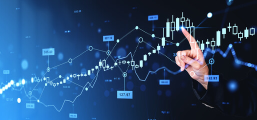 Wall Mural - Woman finger touch forex diagrams and stock market data with lines