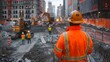 © Sri - Detailed Photo of Construction Worker in Orange Safety Jacket and Helmet Standing on Construction Site