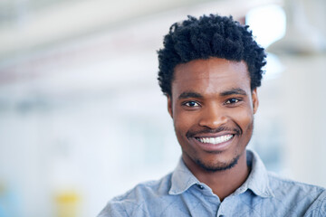 Wall Mural - Business, creative and portrait of black man in office with smile, confidence and mockup at agency. About us, design and happy businessman with opportunity, trust and professional pride at startup