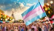 © Arthur - transgender flag on the background of the pride parade, lgbt pride month, fight against transphobia, tolerance