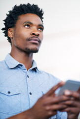 Wall Mural - online, typing and black man with phone to search for info and thinking of post on social media. cre