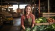 © ORG - Fruit and vegetable shop owner, happy woman holding vegetables near crates in a stall at the market