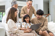 © Art_Photo - Father and mother with asian kid girl learn on laptop computer reviewing lesson study with online education e-learning.student look for educational knowledge in homeschool at home.Education