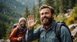 © Hashim - Joyful bearded man waving during a mountain hike with a group of friends