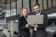 © anatoliycherkas - Portrait of two workers with laptop inside car showroom
