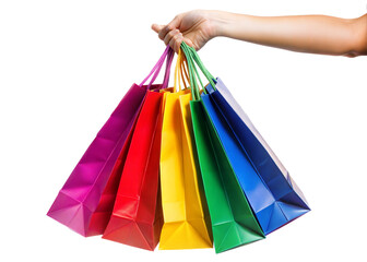 A hand holds multiple vibrant shopping bags, showcasing a rainbow of colors against a white background