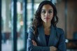 © darshika - latin business woman crossing her arms