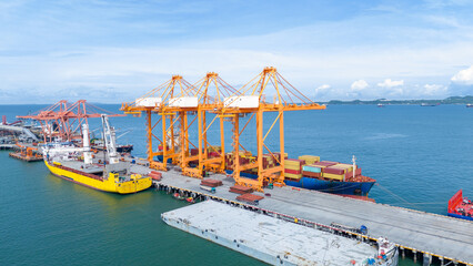 Wall Mural - Crane loading box container to cargo ship at commercial dock port. Shipyard Cargo Container Sea Port Freight forwarding service logistics and transportation. International Shipping  Customs Port..