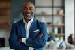 © LukaszDesign - Happy black man with arms crossed or corporate inspiration profile photo. CEO introduction, smile, confident or mature management, success mindset