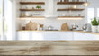 © Iryna - Empty wooden tabletop on blurred rustic kitchen background for mockups. Natural day light. Promotion background.