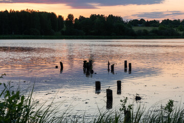 Wall Mural - colorful sunrise, sunset landscape by the lake, brightly colored sky is reflected in the water of the lake