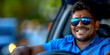 © Anastasiia - Cheerful Indian man in shades enjoys driving car evoking transport and sociable vibes. Concept Transport, Sociable, Indian Man, Driving, Cheerful