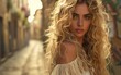 © imagineRbc - A blonde woman with long curly hair standing in an urban alleyway