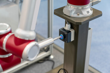 Aufkleber - Industrial Robot presses the button. Accuracy calibration.