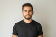 © Web - White Man Serious. Handsome Young Hispanic Man with Beard in Casual T-Shirt Portrait on Isolated White Background