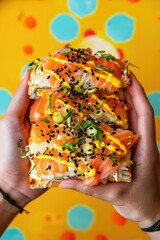 Wall Mural - close up of sushi in hands. Selective focus