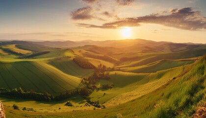 Sticker - a panoramic view of rolling hills and sun drenched fields the setting sun casting a warm golden hue