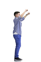 Wall Mural - A man, full-length, on a white background, raised his hands up