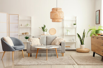 Sticker - Interior of modern living room with grey sofa, coffee table and armchair