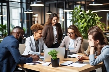 Aufkleber - a group of people sitting around a table with a laptop