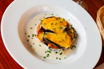 Wall Mural - Delicious Greek moussaka from baked eggplant, tuna, cheese and bechamel sauce..