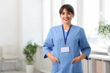 Wall Mural - Portrait of smiling medical assistant in hospital. Space for text