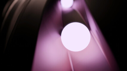 Wall Mural - glowing 3d balls moving on surface. design. neon balls roll along 3d track. glowing balls roll along