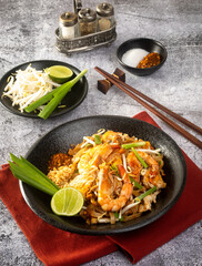 Wall Mural - Pad Thai - stir-fried rice noodles with .shrimp - Thai food style