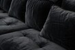 © LimeSky - Close up shot of modern black velvet sofa for background or texture
