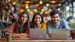 © saurav005 - Group of young indian professionals with laptop in a cafe.