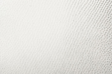 Wall Mural - White textured surface with small circular indentations