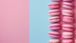 © LimeSky - Pink macarons with empty area Line of flawless French macarons on pink and blue backdrop Aerial view Bright illumination