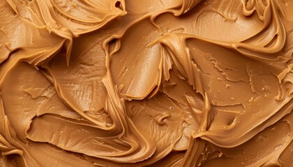 Canvas Print - Smooth creamy peanut butter on a brown background Closeup of a delicious natural dark spread