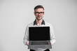 © be free - Businessman business man work online on laptop having video call conference isolated on grey