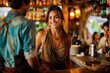 © apratim - Smiling bartender having a friendly conversation with a customer in a cozy, vibrant bar setting.