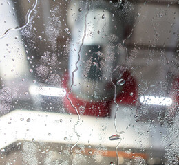 Sticker - Car glass at a car wash In drops of water. Background