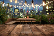 © grey - A wooden bar top in the foreground with a blurred background of an urban rooftop bar. The background includes stylish seating, plants, string lights, a panoramic city view.