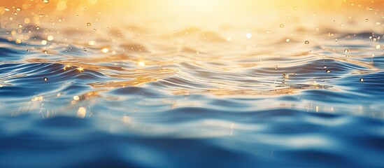 Wall Mural - Abstract golden sunlight bokeh on blue sea water background. copy space available